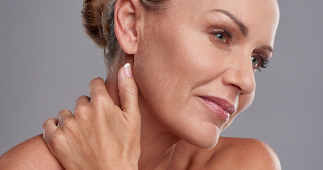 A woman with smooth, glowing skin showing natural radiance after a skin booster treatment.