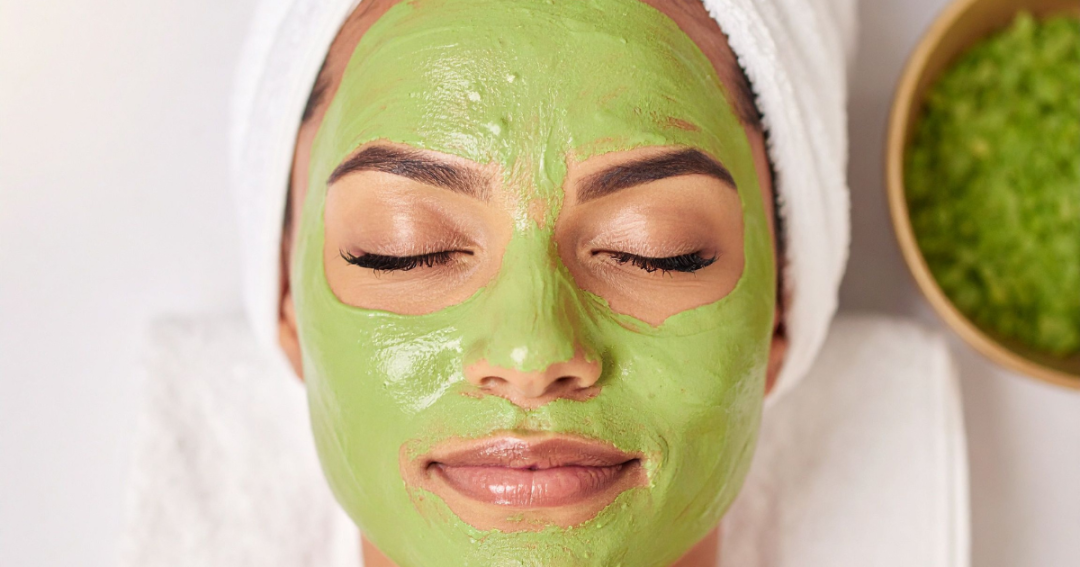 Close-up of a client with a soothing sheet mask applied during a skincare treatment.