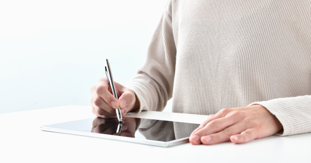 Why Aesthetic Practitioners Are Ditching Paper and Embracing Smarter Consent 1 Patient completing a consent form on a tablet.