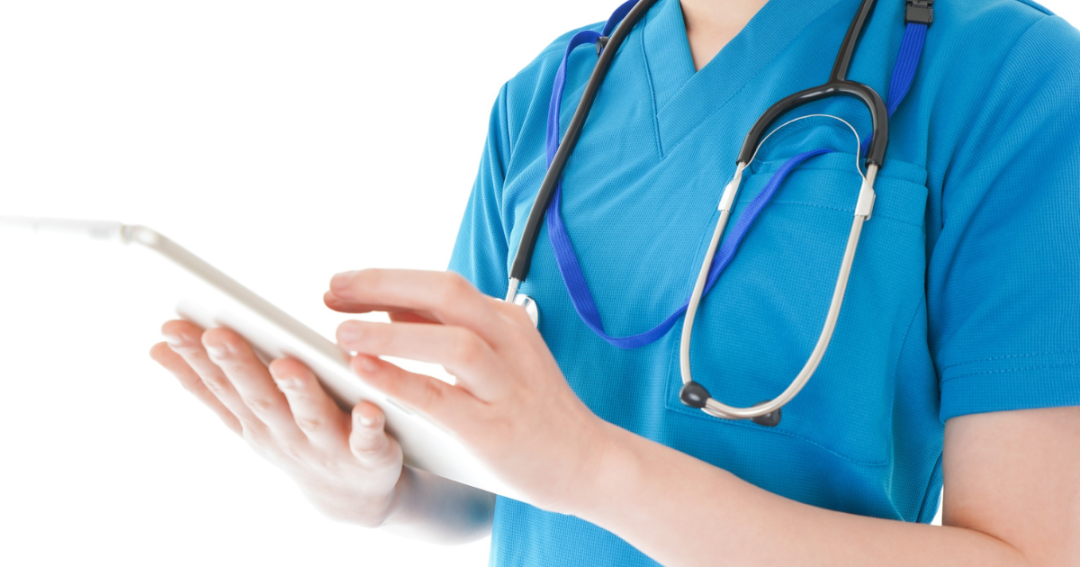The Best Patient Management System 2025 | Top Software for Clinics & Aesthetic Practices 1 Nurse in an aesthetic clinic using a tablet to check client treatment details.