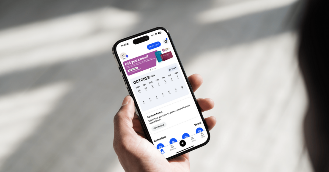 Aesthetic practitioner using secure clinic software on a tablet to manage client records safely.