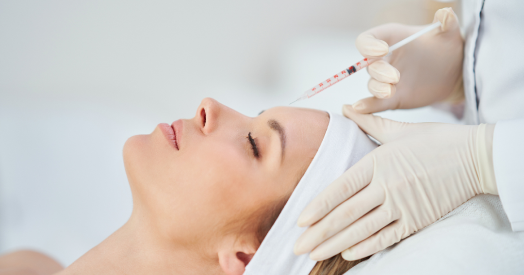 Client receiving a Botox injection from a healthcare professional in a clinical setting.