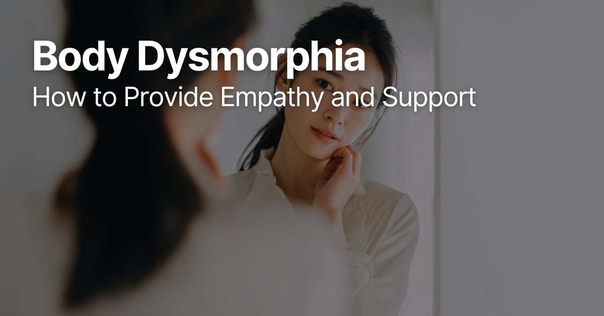 Woman looking at her reflection in the mirror, appearing contemplative and concerned, representing body dysmorphia and self-perception struggles.