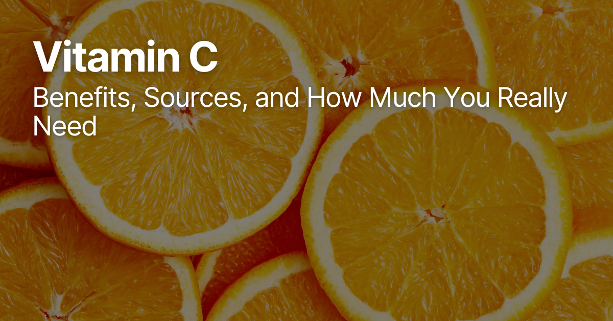 A group of fresh oranges, some whole and some cut in half, showing their bright, juicy flesh rich in vitamin C.