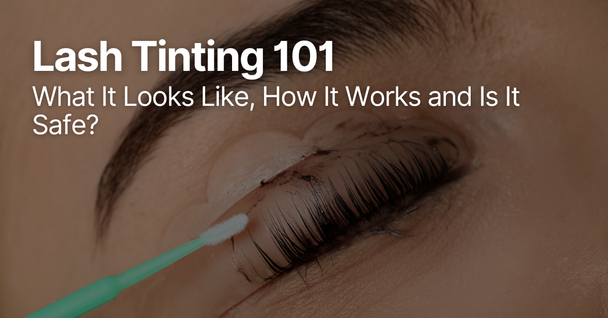 Close-up of a client receiving a professional eyelash tint treatment at a salon.