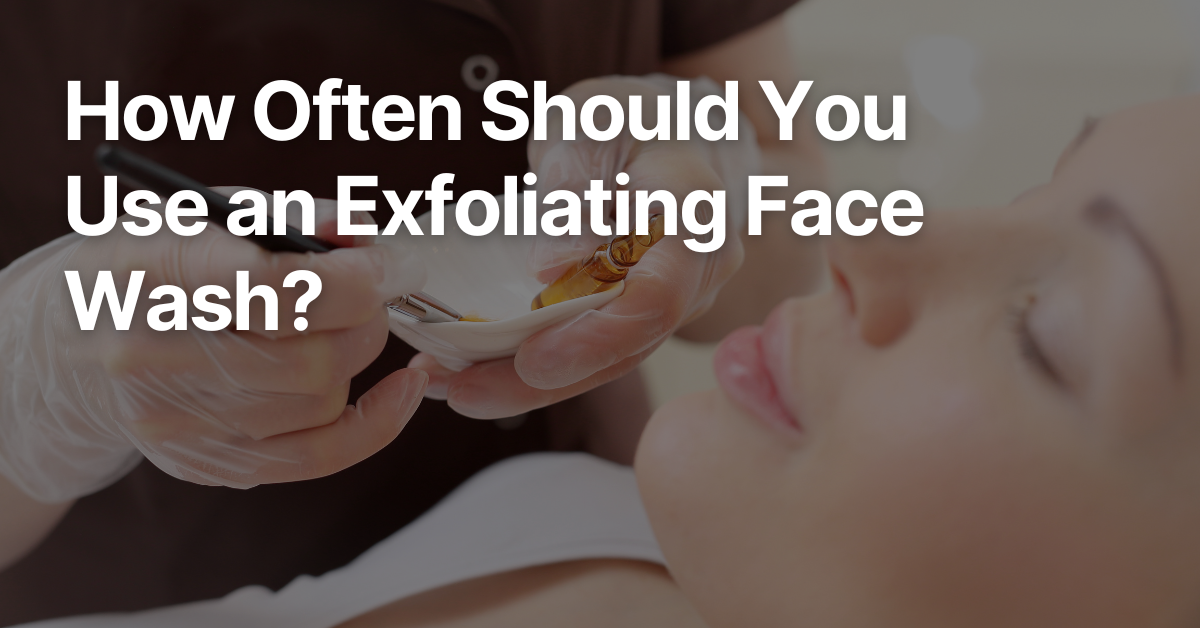 Esthetician gently applying an exfoliating face wash to a client’s skin during a facial treatment.