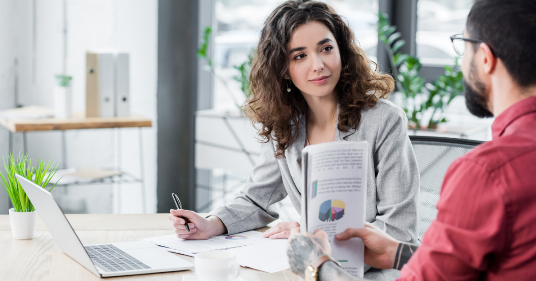 An accountant in a professional meeting with a clinic owner discussing their business finances