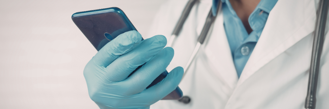 Aesthetic practitioner reviewing the day's appointments on a tablet in a UK clinic treatment room