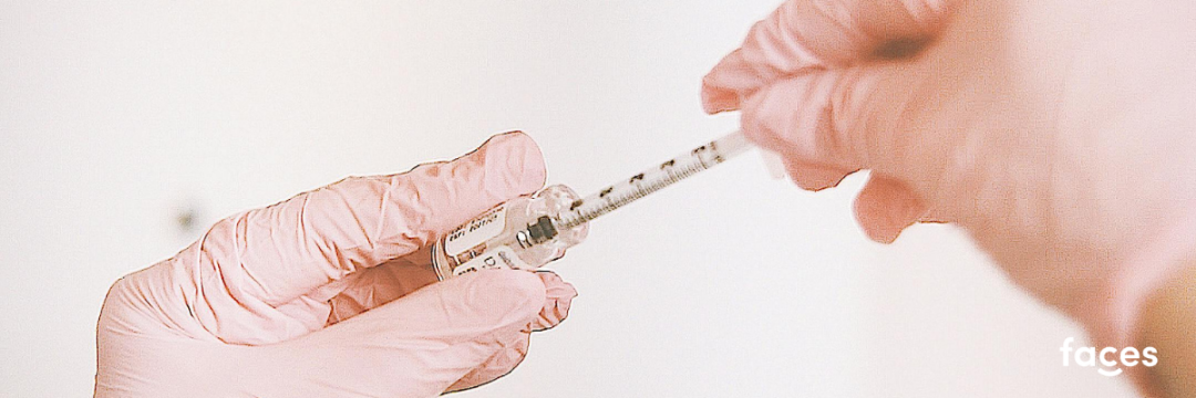 Botulinum toxin vial, insulin syringe and sodium chloride diluent laid out for reconstitution
